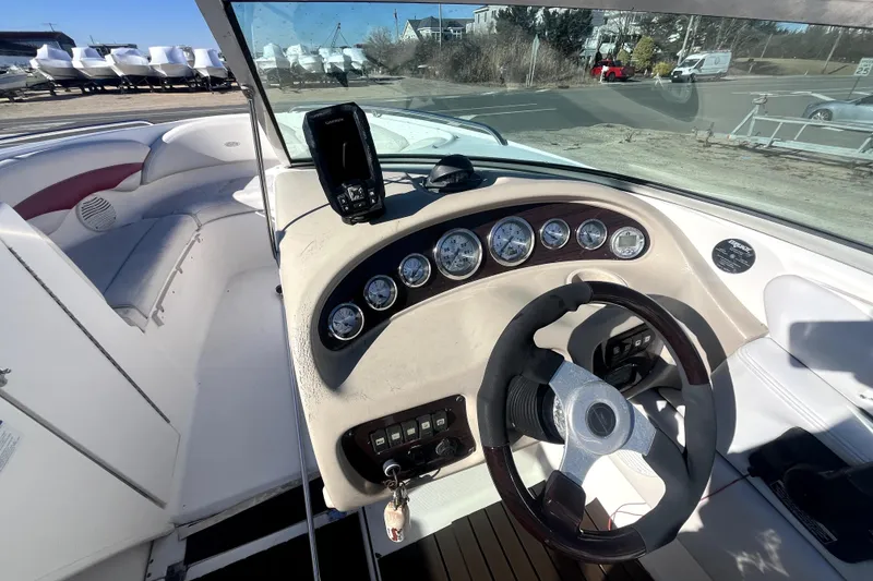 Slide: The Image of Interior view of 2002 Chaparral 216 SSi boat dashboard and steering wheel. - 7