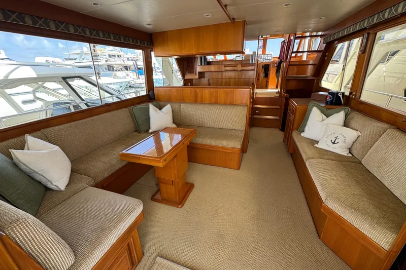 Slide: The Image of Luxurious interior of 1999 Offshore Yachts 52 Pilothouse with plush seating and wooden accents. - 10
