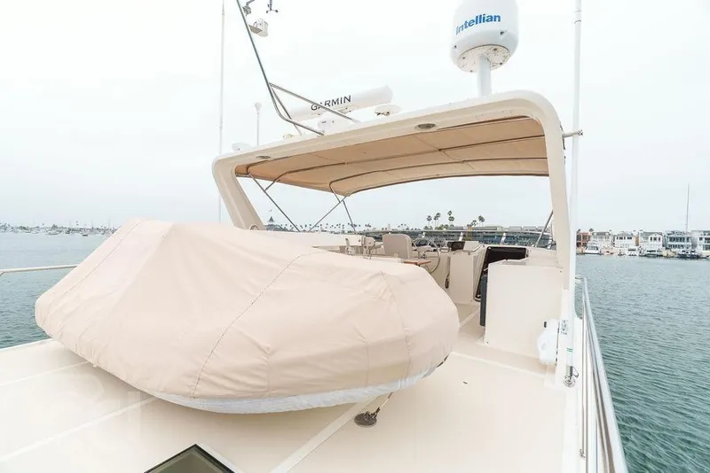 Slide: The Image of 1999 Offshore Yachts 52 Pilothouse with covered deck, docked in a marina. - 3