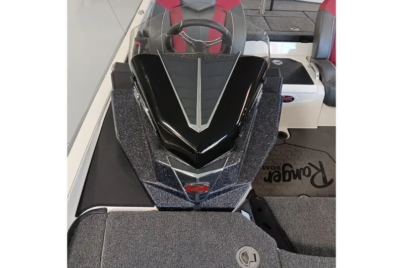 Slide: The Image of 2025 Ranger Z520 boat interior with sleek black console and red-accented seating. - 14