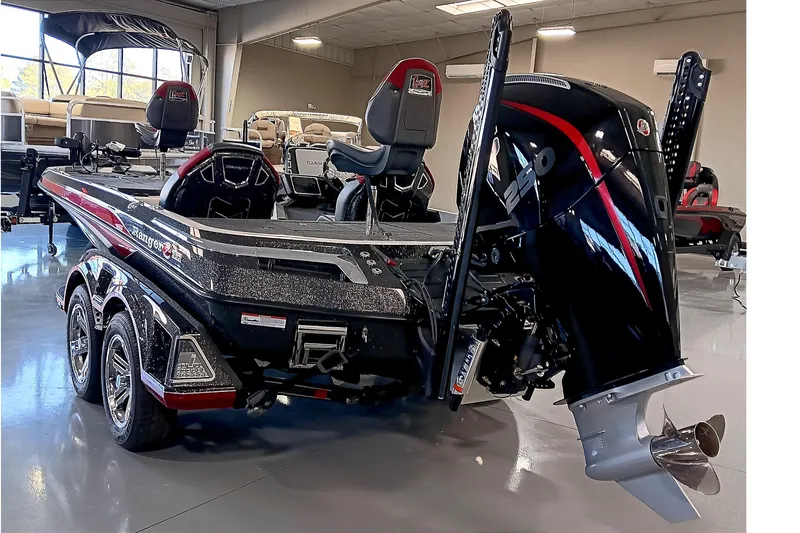 Slide: The Image of 2025 Ranger Z520 boat with powerful outboard motor in showroom setting. - 4