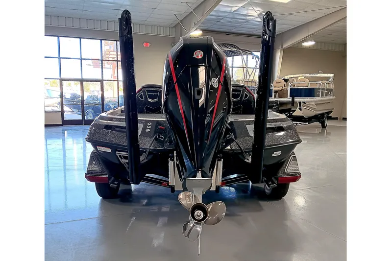 Slide: The Image of 2025 Ranger Z520 boat in showroom, rear view with motor and propeller. - 5