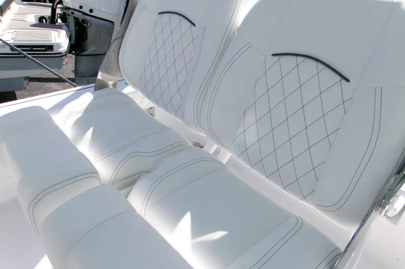 Slide: The Image of 2026 Sportsman Masters 247 Bay Boat with luxurious white quilted seating. - 5