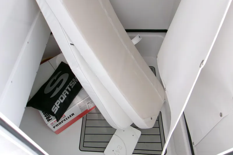 Slide: The Image of Interior storage of 2026 Sportsman Masters 247 Bay Boat with cushions and propeller box. - 9