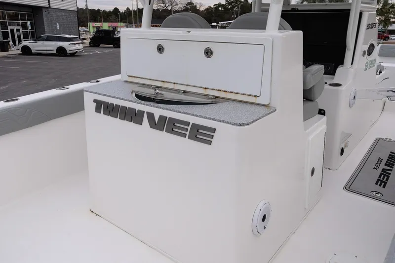 Slide: The Image of 2023 Twin Vee 280 GFX CC boat interior with storage compartment and seating. - 12