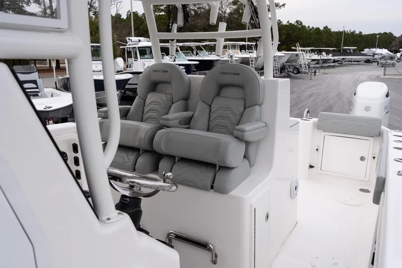 Slide: The Image of 2023 Twin Vee 280 GFX CC boat with comfortable seating and modern design. - 16