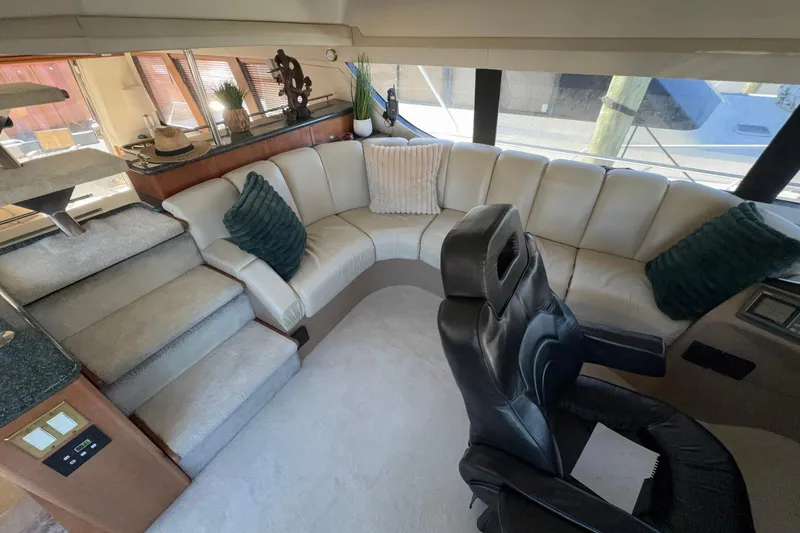 Slide: The Image of Luxurious interior of 1999 Carver 530 Voyager Pilothouse with plush seating and elegant decor. - 33