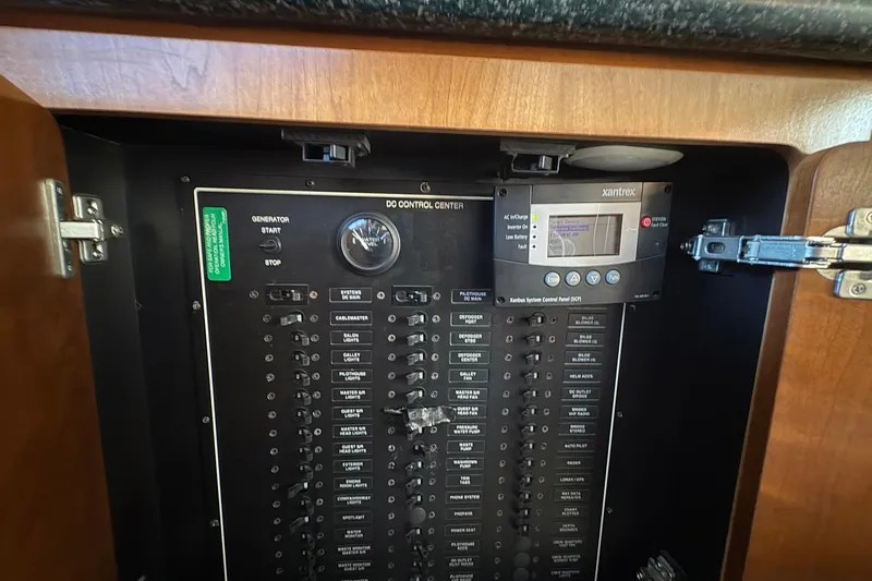 Slide: The Image of Electrical control panel inside a 1999 Carver 530 Voyager Pilothouse yacht. - 56