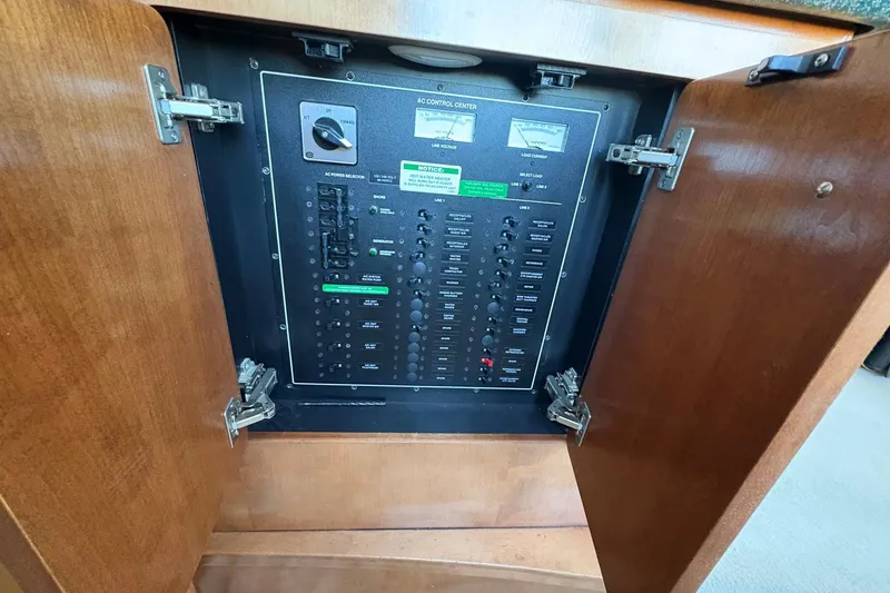 Slide: The Image of Electrical control panel inside a 1999 Carver 530 Voyager Pilothouse yacht. - 57