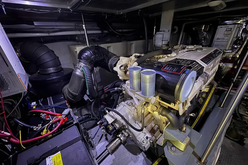 Slide: The Image of Engine room of 1999 Carver 530 Voyager Pilothouse with visible machinery and components. - 59
