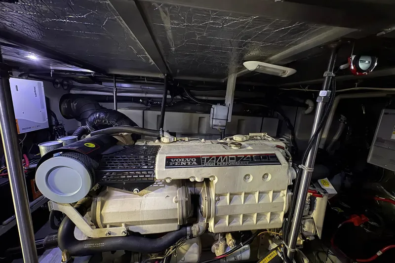 Slide: The Image of Engine room of 1999 Carver 530 Voyager Pilothouse with Volvo Penta engine. - 60