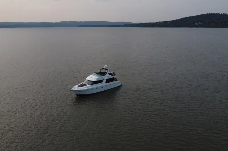 Slide: The Image of Aerial view of 1999 Carver 530 Voyager Pilothouse yacht on calm water. - 64