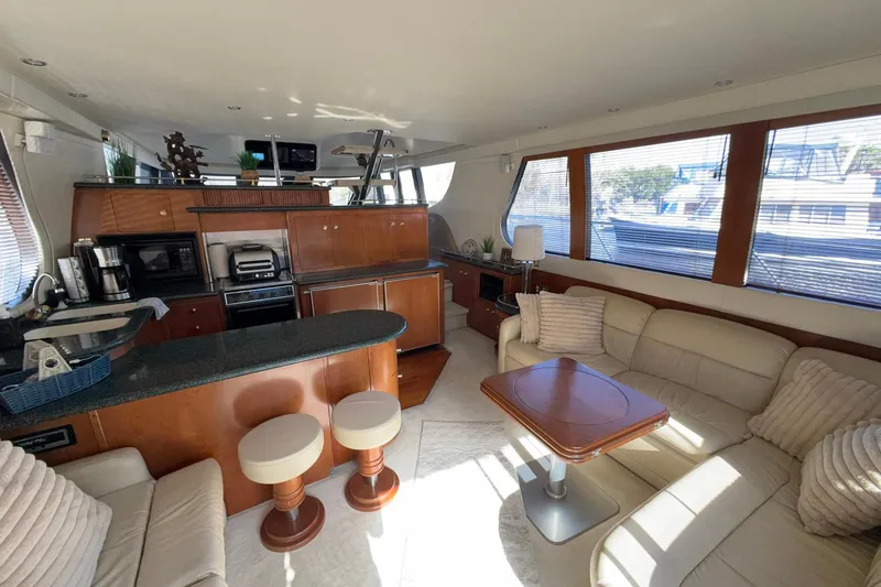 Slide: The Image of Luxurious interior of 1999 Carver 530 Voyager Pilothouse with modern kitchen and seating area. - 23