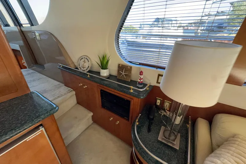 Slide: The Image of Interior of 1999 Carver 530 Voyager Pilothouse with elegant decor and natural light. - 31