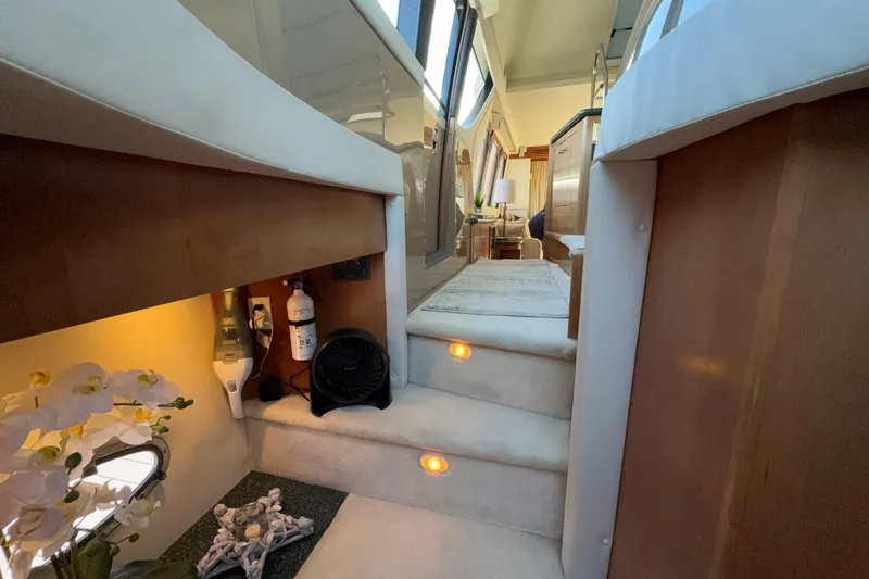 Slide: The Image of Interior of 1999 Carver 530 Voyager Pilothouse with elegant staircase and modern decor. - 36