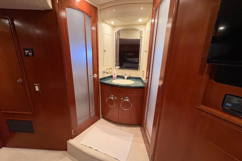 Slide: The Image of Luxurious bathroom interior of 1999 Carver 530 Voyager Pilothouse yacht with wood accents. - 41