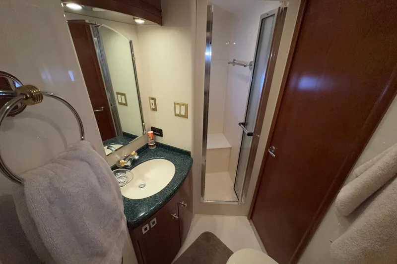 Slide: The Image of Bathroom interior of 1999 Carver 530 Voyager Pilothouse with sink, mirror, and shower. - 49