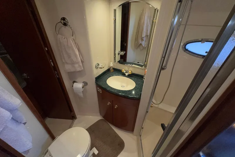 Slide: The Image of Bathroom interior of 1999 Carver 530 Voyager Pilothouse yacht, featuring sink and shower. - 50
