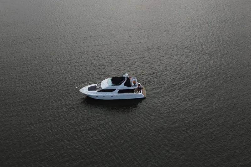 Slide: The Image of Aerial view of 1999 Carver 530 Voyager Pilothouse yacht on calm water. - 65