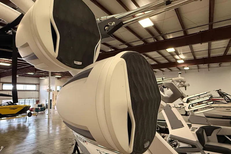 Slide: The Image of 2022 Malibu M220 boat speakers in a showroom setting. - 15