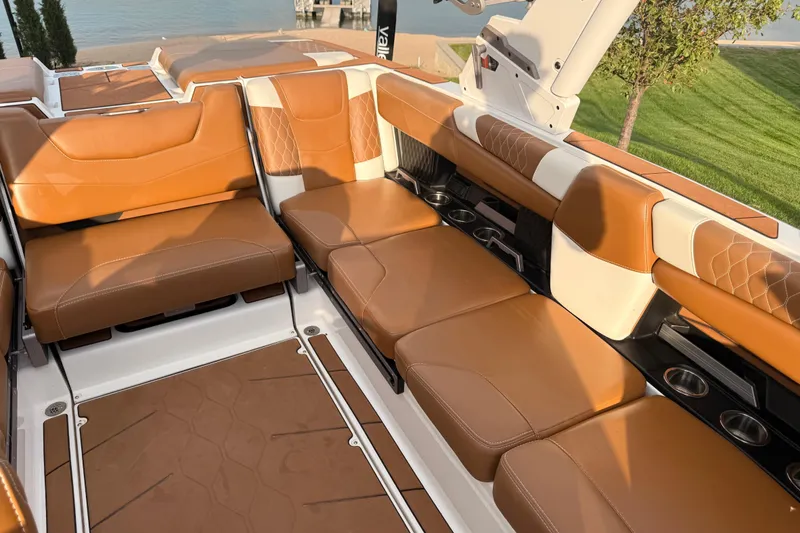 Slide: The Image of Luxurious interior of 2022 Malibu M220 boat with tan leather seating. - 8