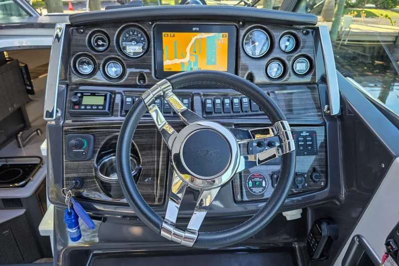 Slide: The Image of Interior of 2022 Monterey 295 Sport Yacht with seating and round table. - 13