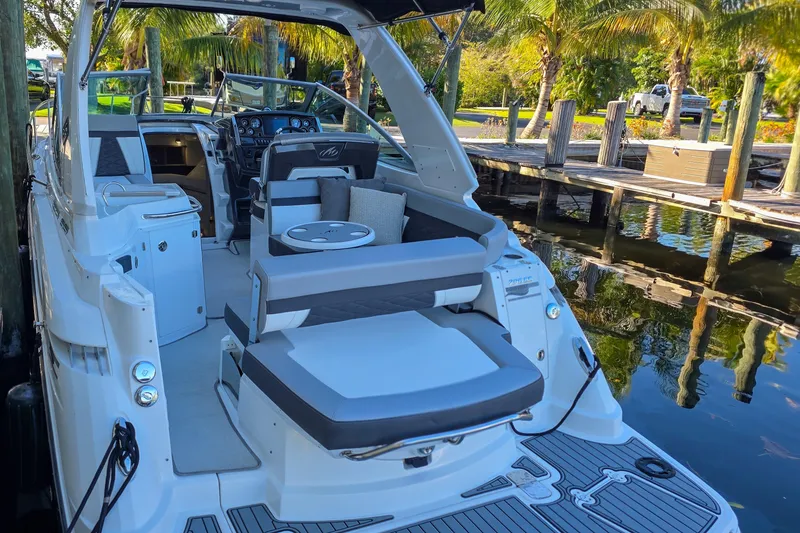 Slide: The Image of Luxurious interior of 2022 Monterey 295 Sport Yacht with modern seating and ambient lighting. - 2