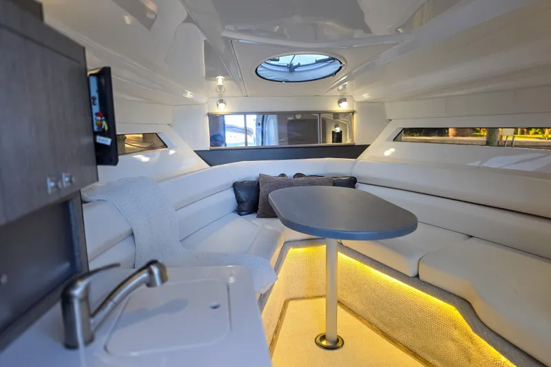 Slide: The Image of Luxurious interior of 2022 Monterey 295 Sport Yacht with modern kitchen and entertainment area. - 3