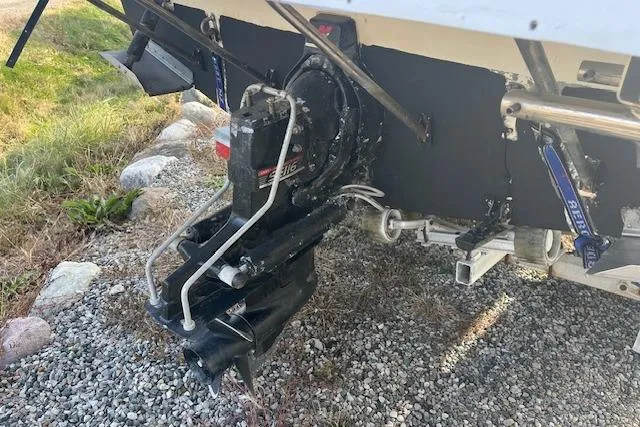 Slide: The Image of Rear view of a 2004 Bayliner 242 Classic boat showing the outboard motor. - 6