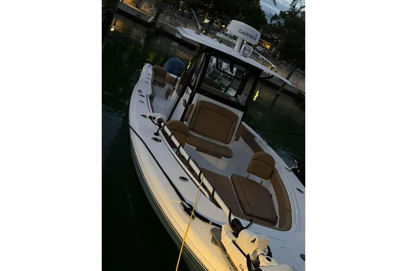 Slide: The Image of 2021 Sea Hunt Gamefish 30 Forward Seating boat docked at marina. - 11