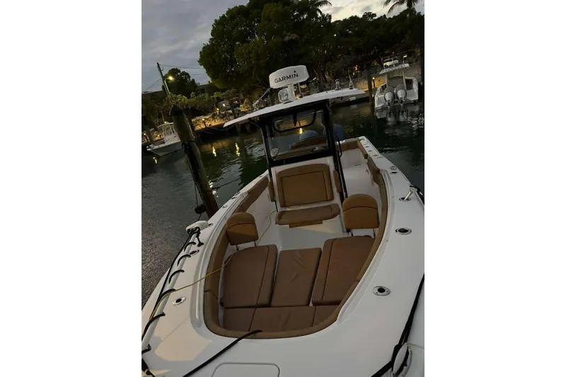 Slide: The Image of 2021 Sea Hunt Gamefish 30 Forward Seating boat docked at marina during evening. - 14