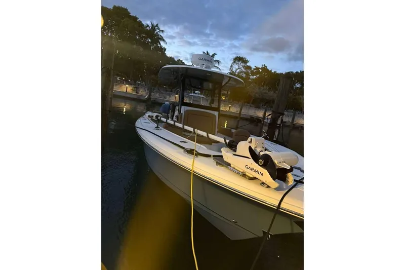 Slide: The Image of 2021 Sea Hunt Gamefish 30 boat docked at sunset with Garmin equipment. - 17