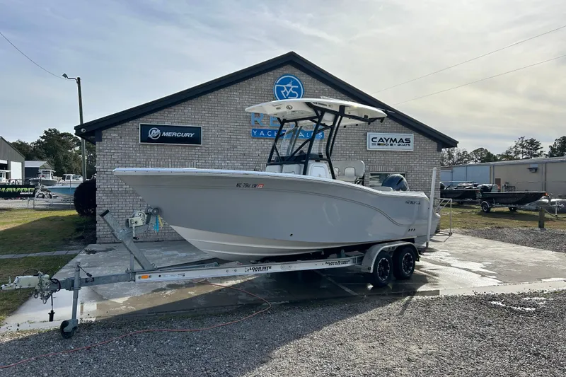 The Image of 2022 Sea Fox 228 Commander boat on trailer outside dealership. - 0