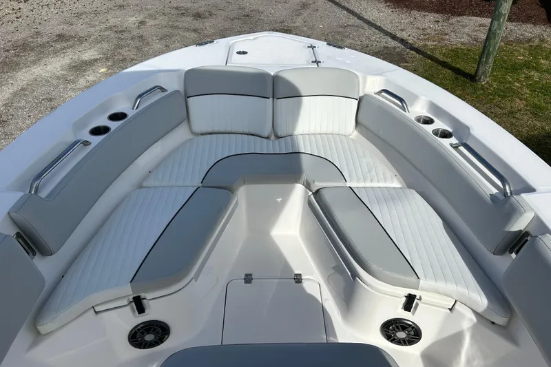 Slide: The Image of 2022 Sea Fox 228 Commander boat interior with cushioned seating and cup holders. - 10