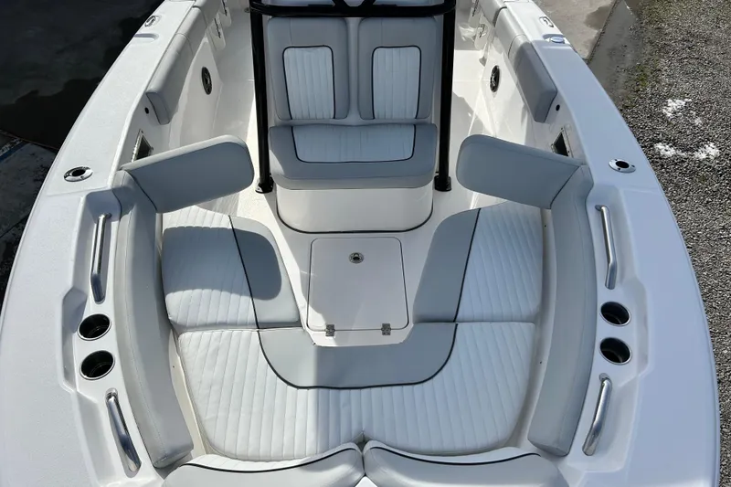 Slide: The Image of 2022 Sea Fox 228 Commander boat interior with cushioned seating and cup holders. - 12