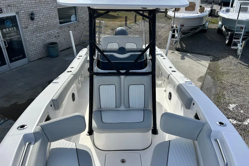 Slide: The Image of 2022 Sea Fox 228 Commander boat with white seating and sleek design. - 13