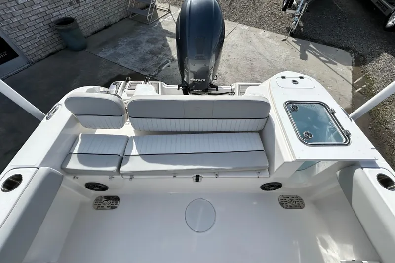 Slide: The Image of 2022 Sea Fox 228 Commander boat interior with seating and engine view. - 22