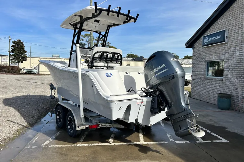 Slide: The Image of 2022 Sea Fox 228 Commander boat with Yamaha engine on trailer, parked outside. - 3