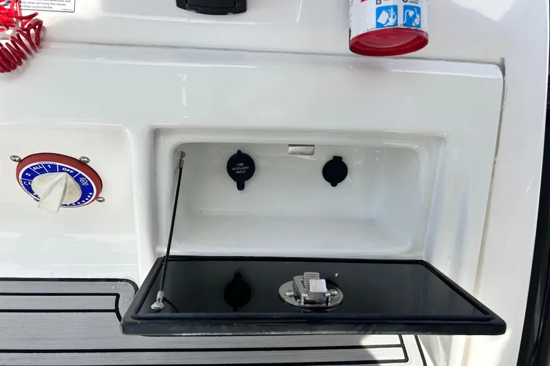 Slide: The Image of 2022 Sea Fox 228 Commander boat dashboard with USB auxiliary input and control panel. - 30