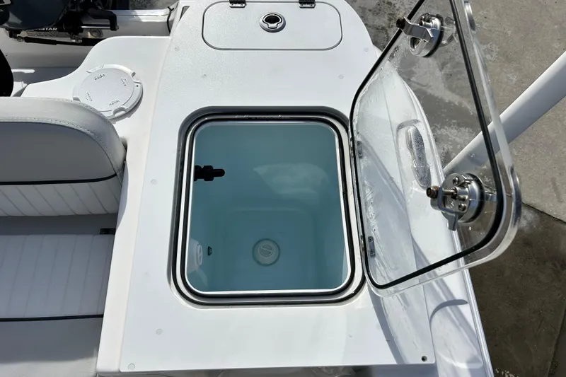 Slide: The Image of 2022 Sea Fox 228 Commander boat with open livewell and seating. - 31