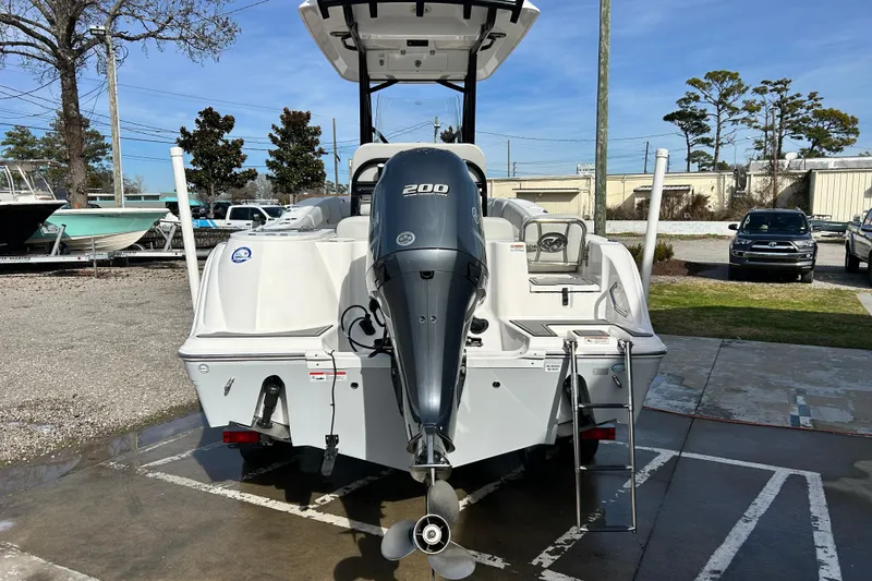 Slide: The Image of 2022 Sea Fox 228 Commander boat with 200 HP engine, parked outdoors. - 4
