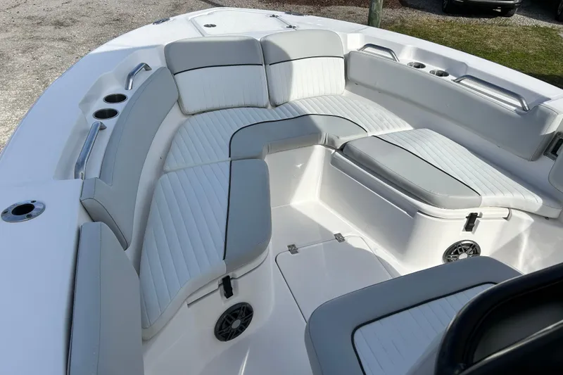 Slide: The Image of 2022 Sea Fox 228 Commander boat interior with cushioned seating and cup holders. - 9