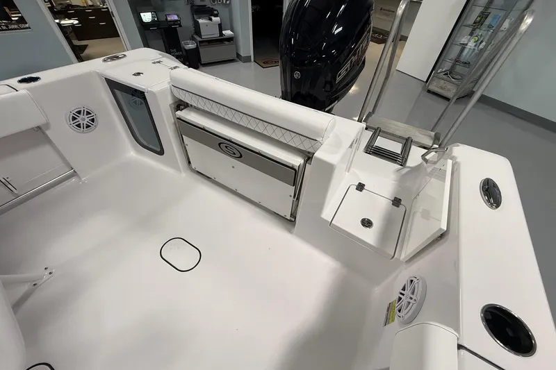 Slide: The Image of 2026 Sportsman Open 232 Center Console boat interior with seating and storage features. - 12