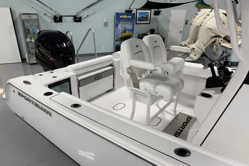 Slide: The Image of 2026 Sportsman Open 232 Center Console boat interior with dual seats and engine. - 9