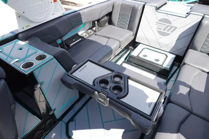 Slide: The Image of Luxurious interior of 2022 Malibu Wakesetter 25 LSV with cup holders and seating. - 12