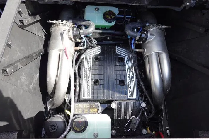 Slide: The Image of Engine compartment of 2022 Malibu Wakesetter 25 LSV, featuring a supercharged power unit. - 19