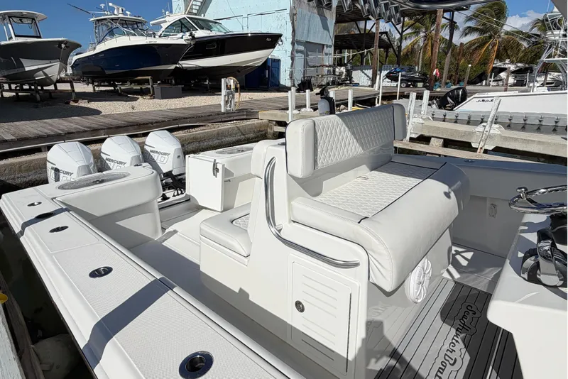 Slide: The Image of 2021 SeaHunter 35 Tournament boat docked, showcasing sleek design and spacious seating. - 10