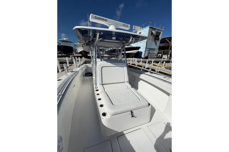 Slide: The Image of 2021 SeaHunter 35 Tournament boat with cushioned seating and Garmin equipment. - 9