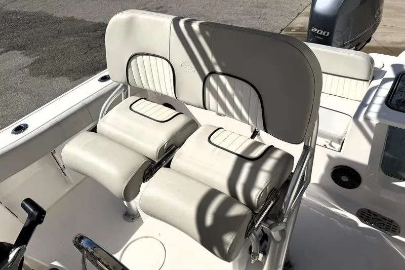 Slide: The Image of 2023 Sea Fox 228 Commander boat seating with white upholstery and dual seats. - 7