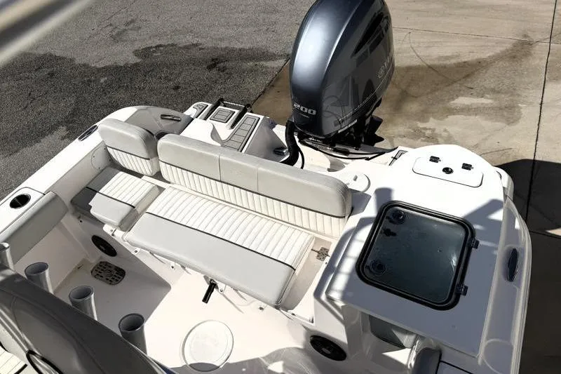 Slide: The Image of 2023 Sea Fox 228 Commander boat interior with seating and outboard motor. - 8